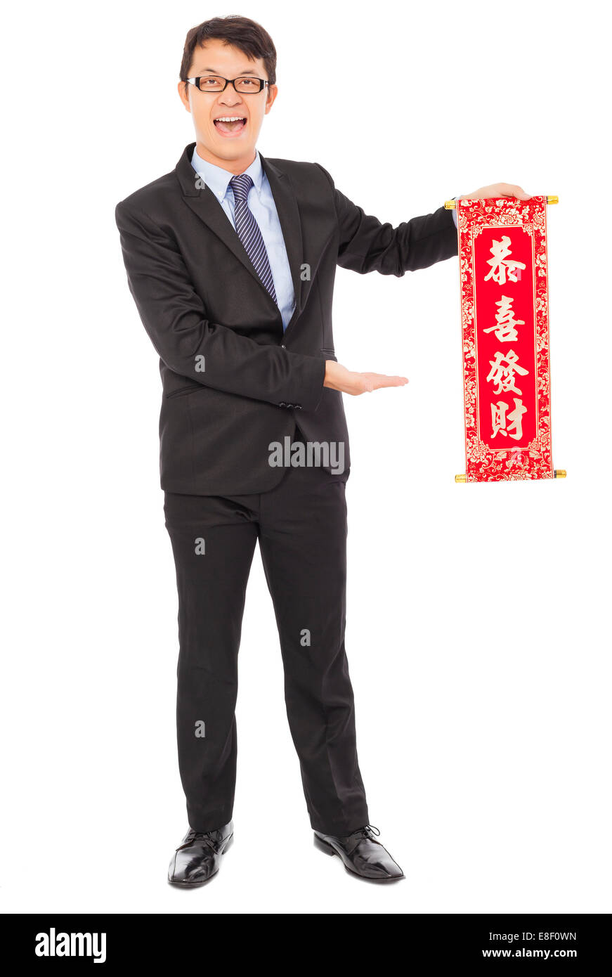 asiatische junge Geschäftsmann hält eine Herzlichen Glückwunsch Reel. Frohes neues Jahr Segen Stockfoto
