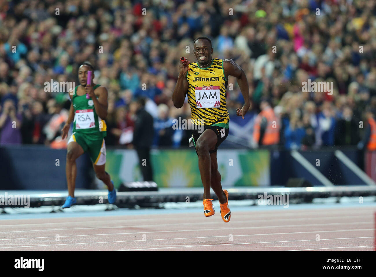 Usain Bolt leitet das Jamaika-Team die Goldmedaille. England nehmen der Silbermedaille und Trinidad und Tobago nehmen die Bronze-Medaille Stockfoto