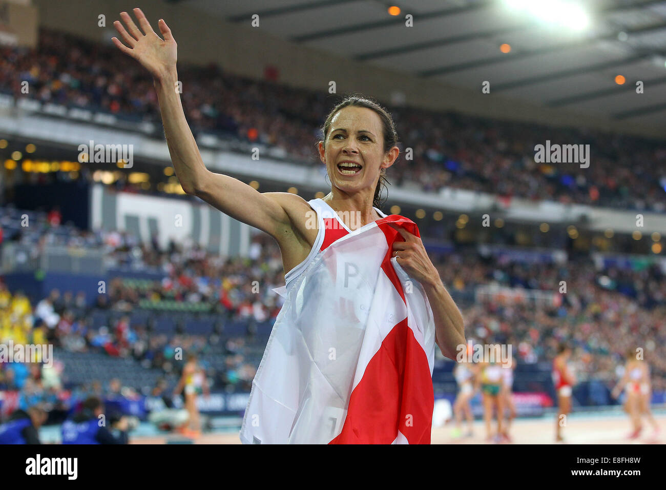 Jo Pavey (ENG)-Bronze-Medaille feiert - Frauen 5000 m Finale. Leichtathletik - Hampden Park - Glasgow - UK - 08.02.2014 - Commonwealt Stockfoto