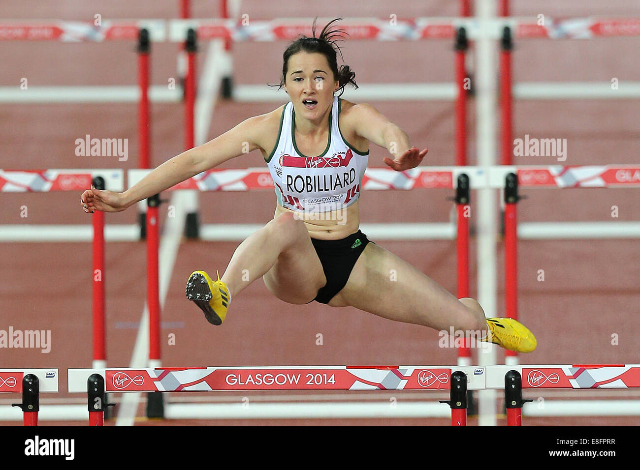 Kylie Robilliard (GGY) in Runde 1, Heat 3 - 100-Meter-Hürdenlauf der Frauen in Aktion. Leichtathletik - Hampden Park - Glasgow - UK - 31.07.2014 Stockfoto