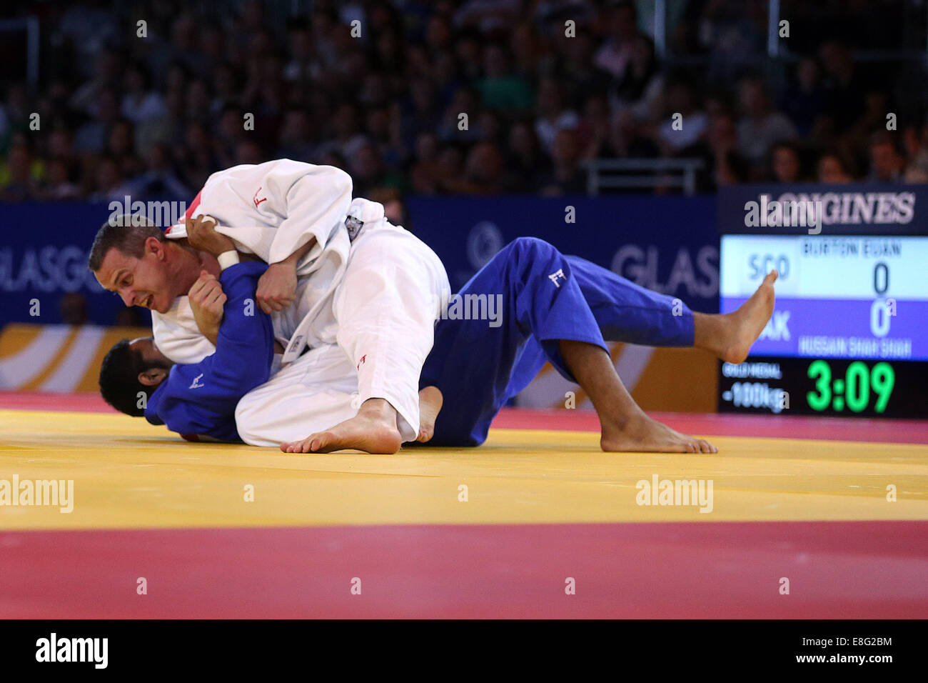 Euan Burton (SCO) (weiß) schlägt Shah Hussain (PAK) (blau) - Judo 100kg Final - SECC - Glasgow Schottland, Glasgow UK - 260714 - 2 Stockfoto