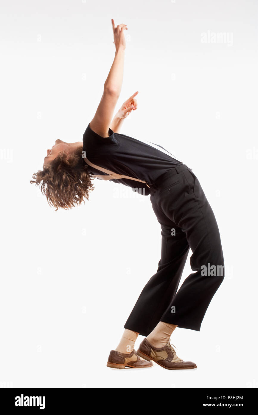Junger Mann mit braunen Haaren tanzen - Isolated on White. Stockfoto
