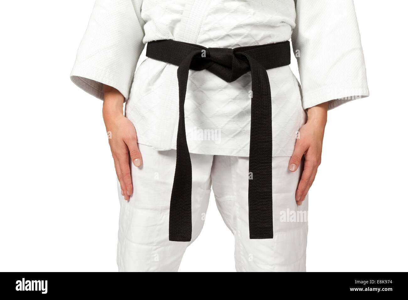 Frauen tragen einen schwarzen Gürtel, isoliert auf weiss Stockfoto