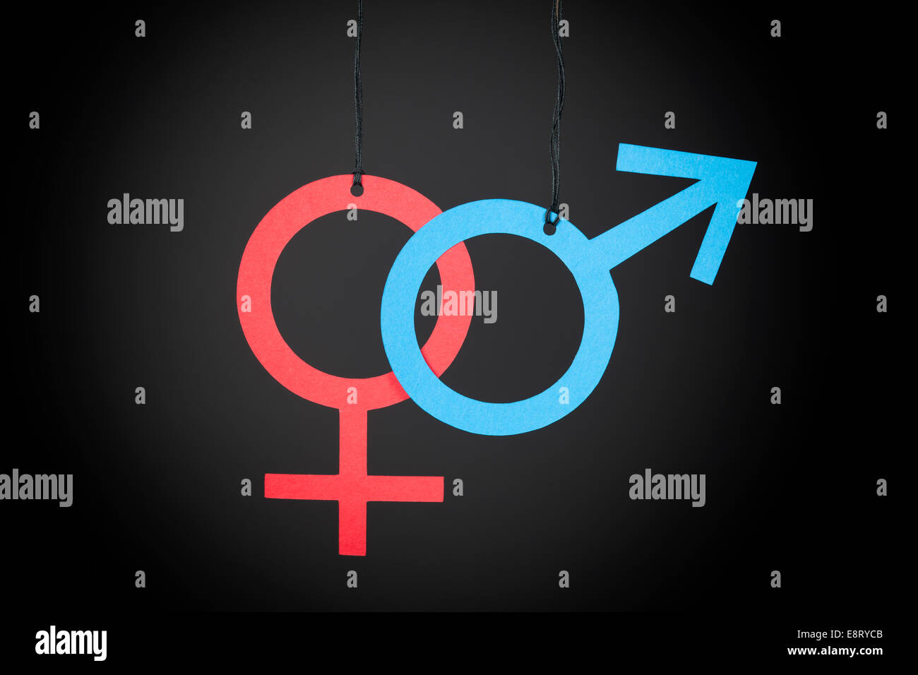 Papier-Gender-Symbole. Schwarzer Hintergrund. Stockfoto