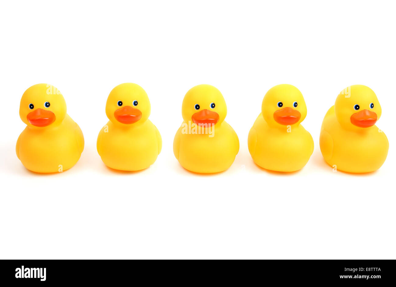 Gelbe Badezeit Enten in einer Reihe Stockfoto