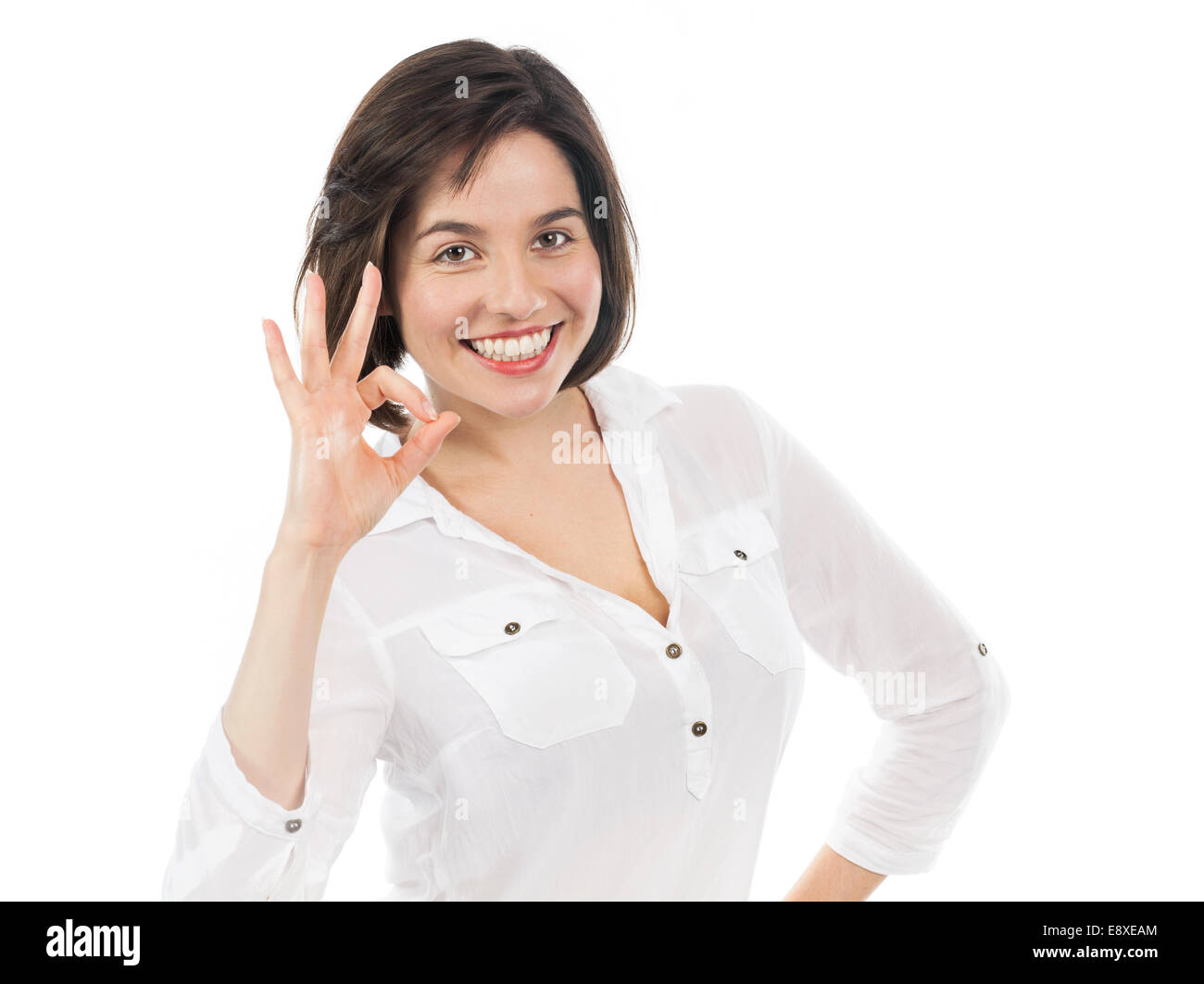 Porträt der selbstbewusste Frau, die eine erfolgreiche Geste, isoliert auf weiss Stockfoto