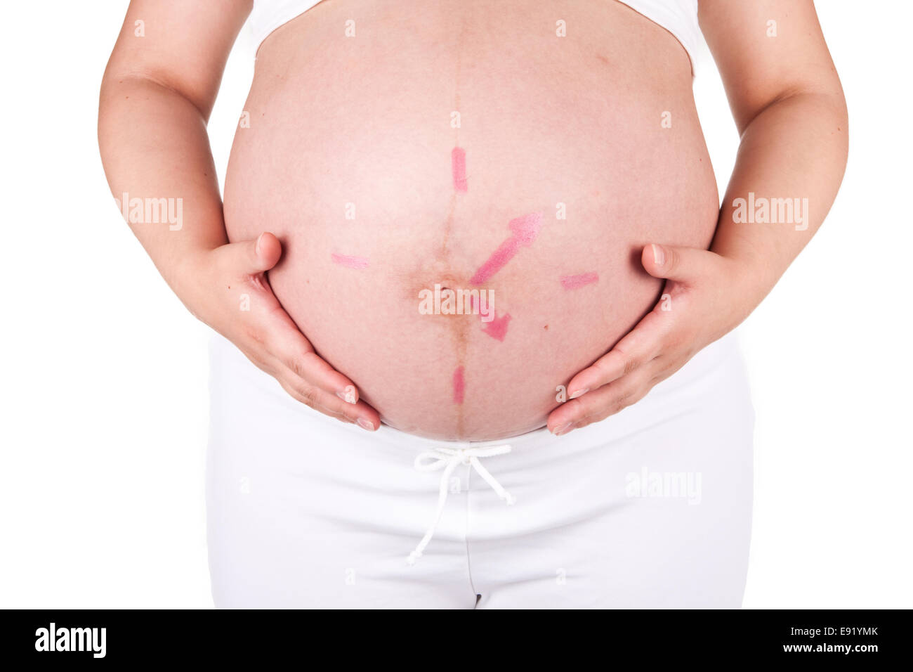 Uhr auf eine Frau Bauch Stockfoto