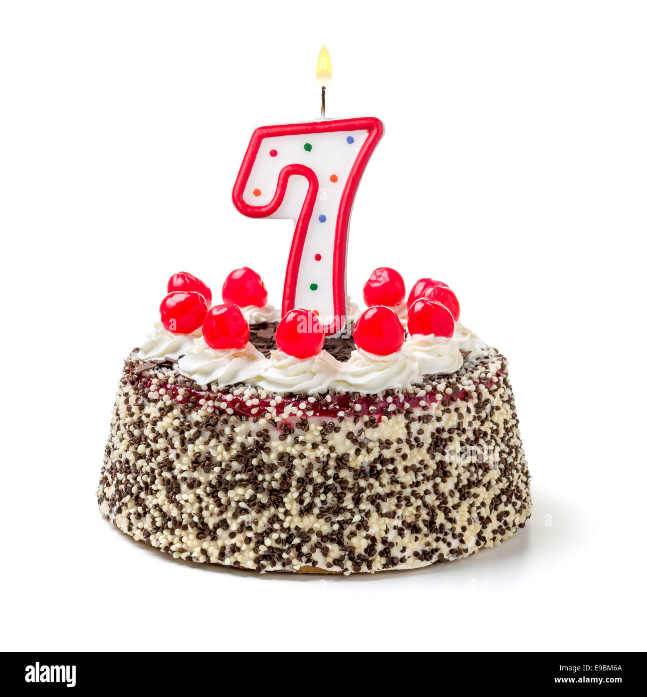 Geburtstagstorte mit brennenden Kerze Nummer 7 Stockfoto