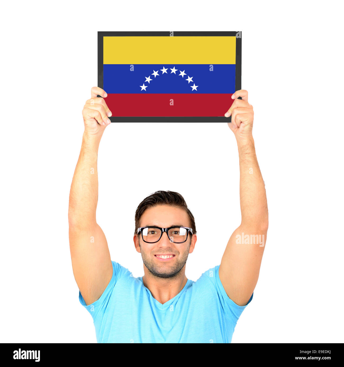 Porträt eines jungen lässig hochhalten Board mit Nationalflagge von Venezuela Stockfoto