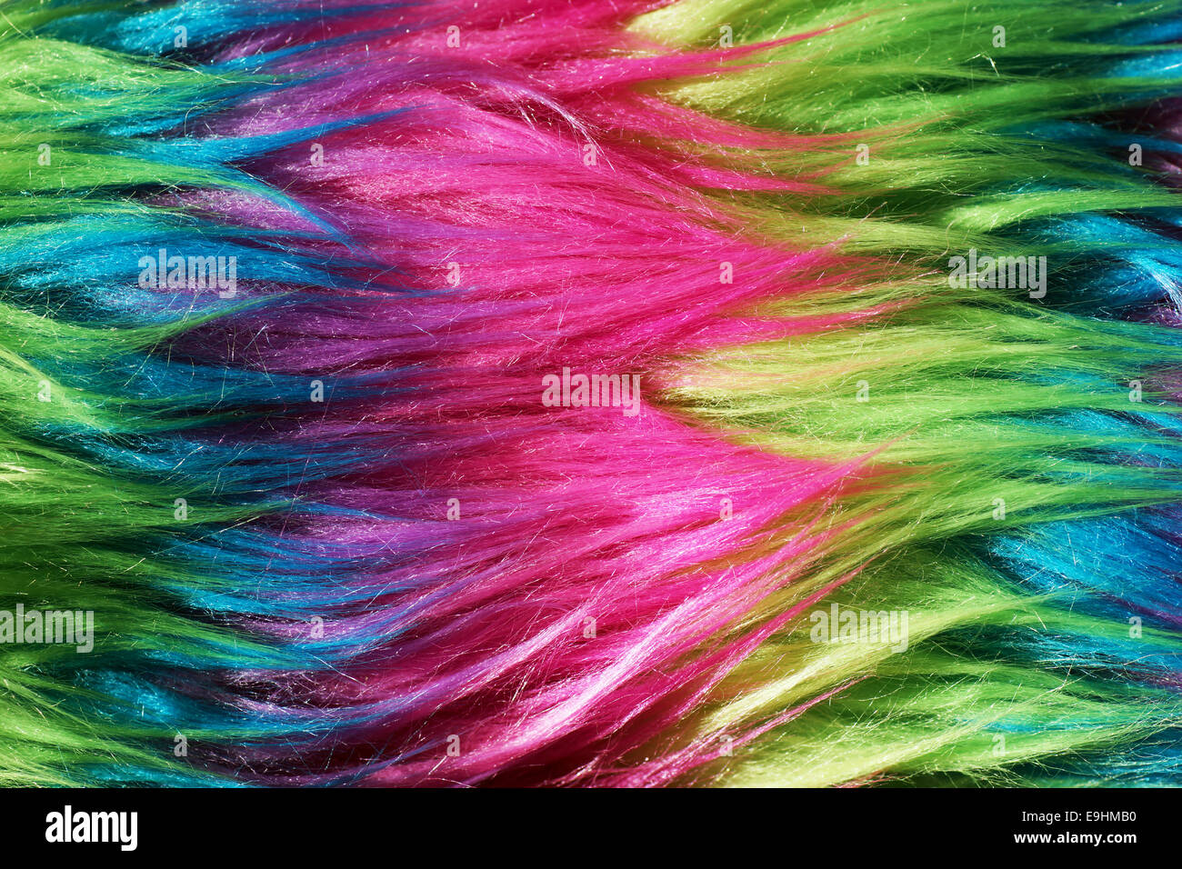 Farbige Neon-Nylon-Fasern oder Kunstpelz Hintergrund Stockfoto