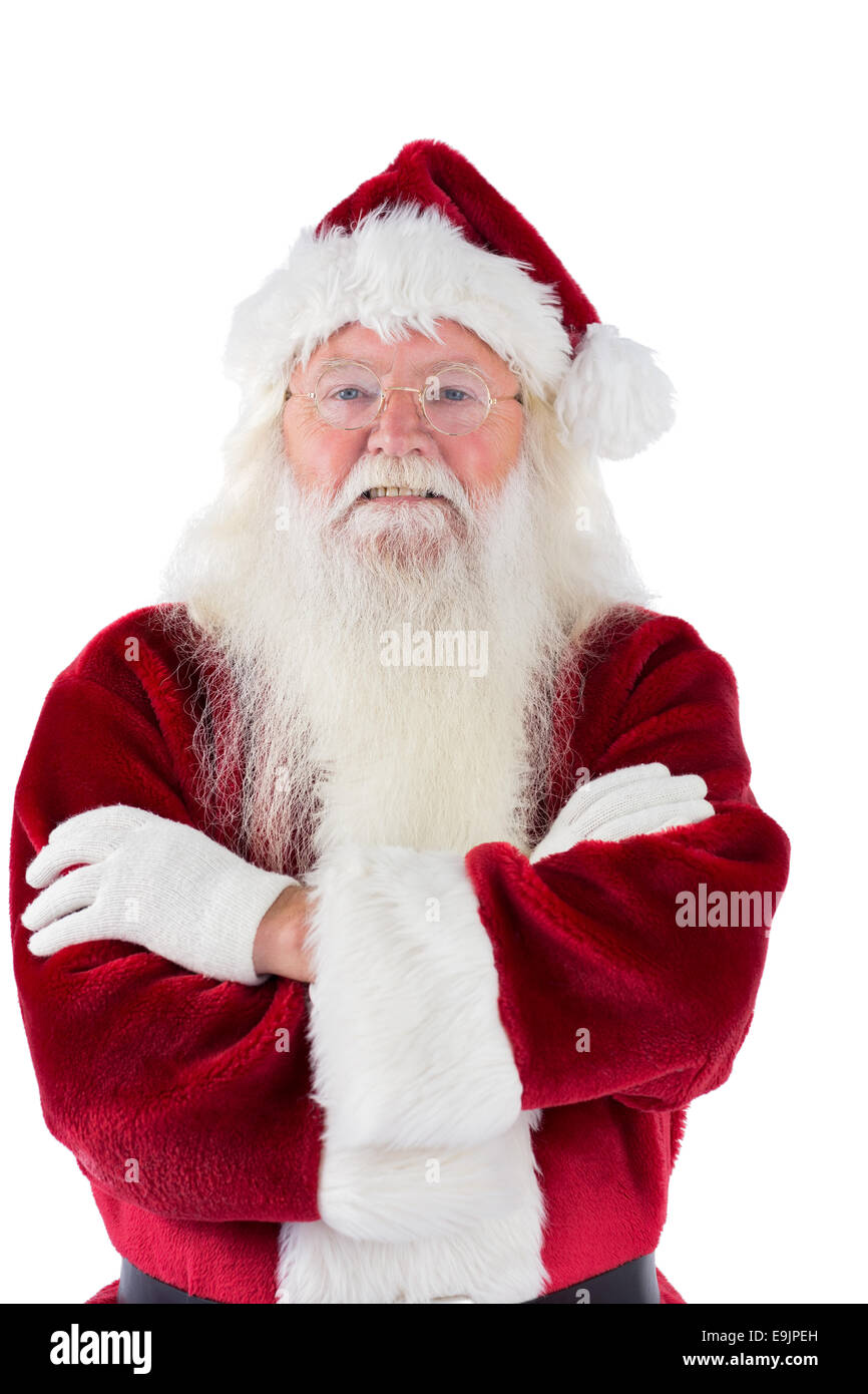 Santa lächelt mit verschränkten Armen Stockfoto