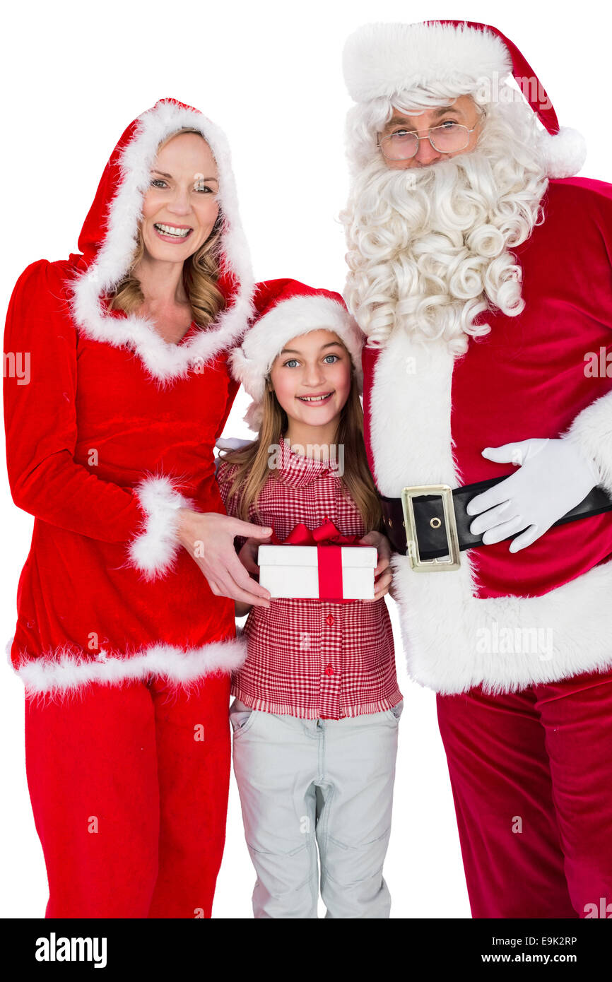 Weihnachtsmann und Frau Claus lächelnd in die Kamera mit kleinen Mädchen Stockfoto