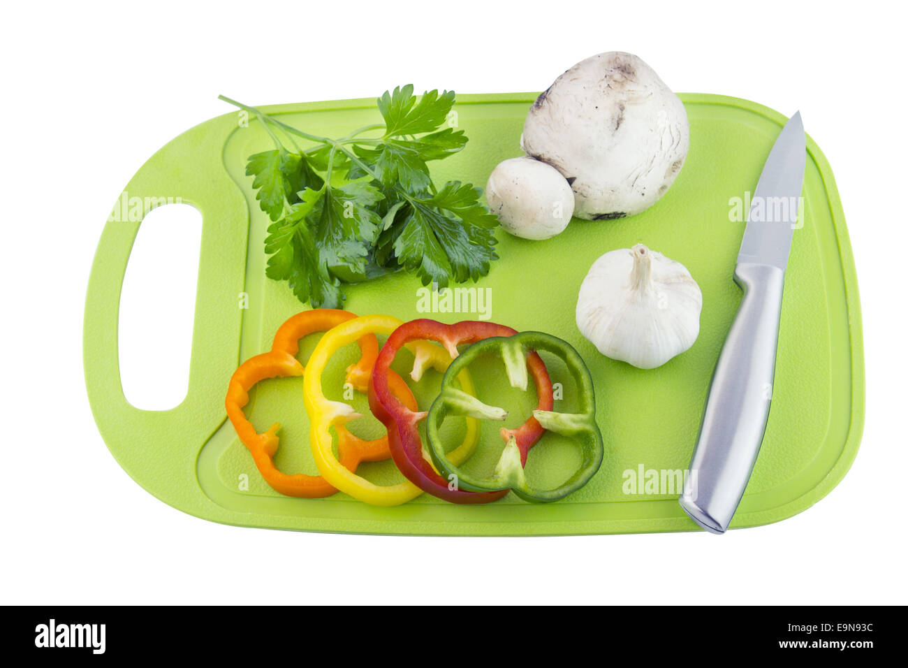 Petersilie und Pilze auf grüner Kunststoff-Grundplatte Stockfoto