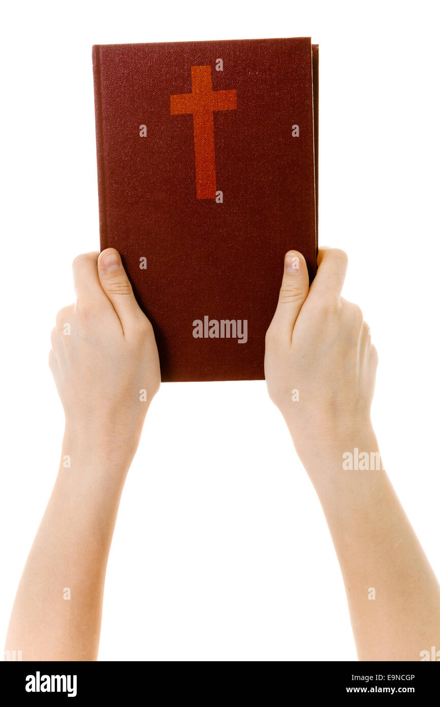 auf einem weißen Hintergrund Hände halten eine Bibel Stockfoto