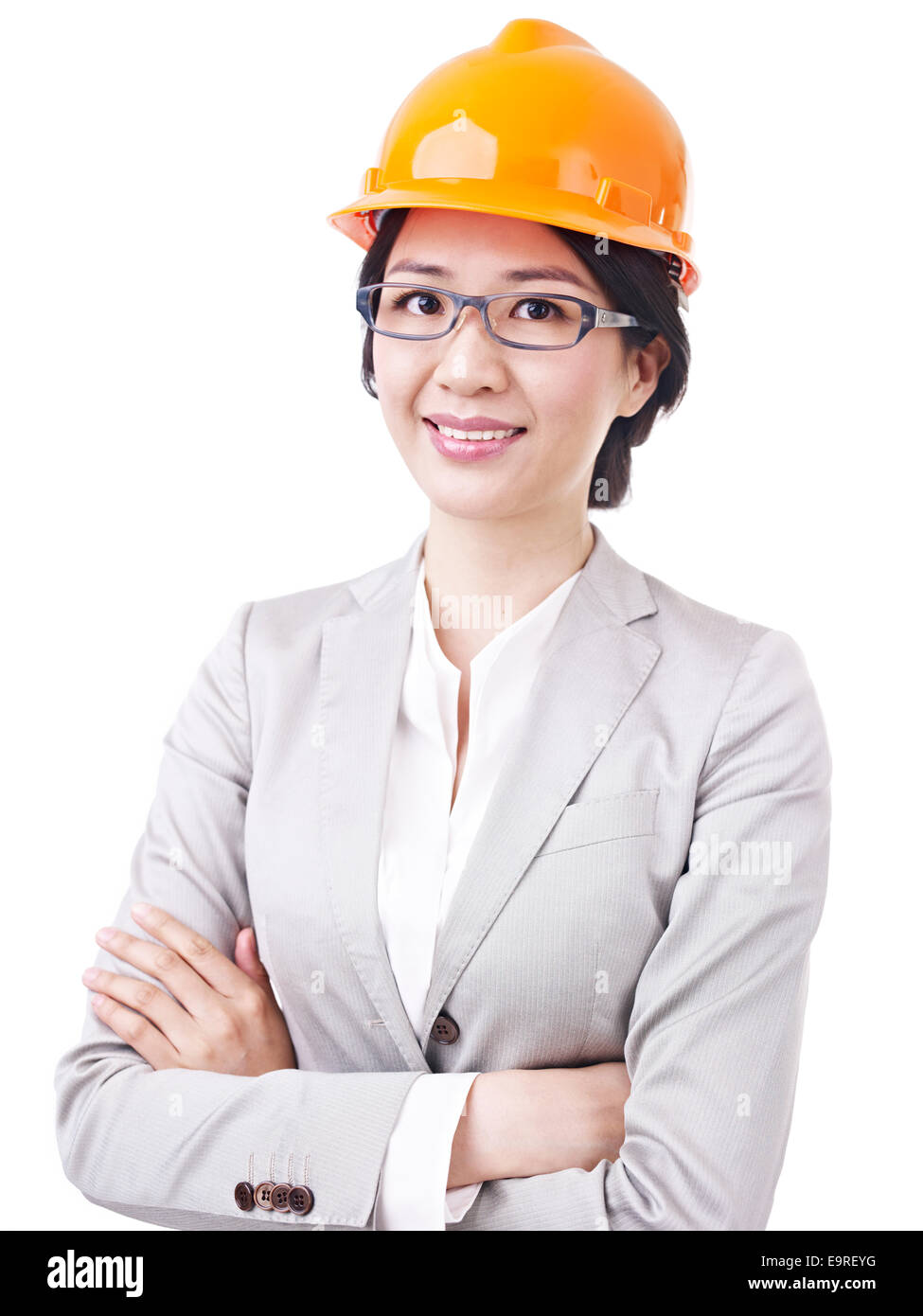 Geschäftsfrau mit Bauarbeiterhelm Stockfoto