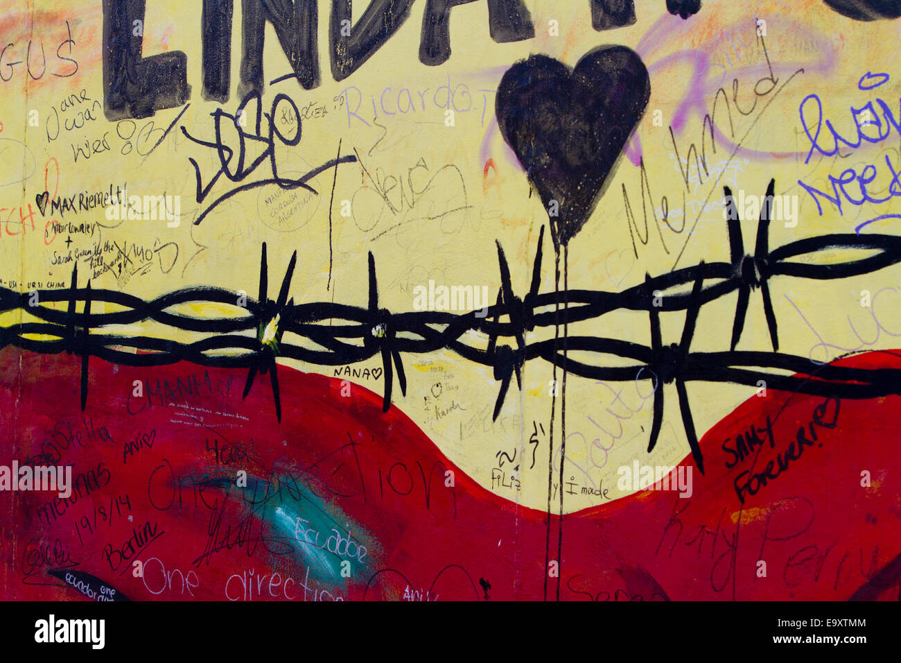 Berlin Wall Graffiti cartoon bunte Stacheldraht Stockfoto