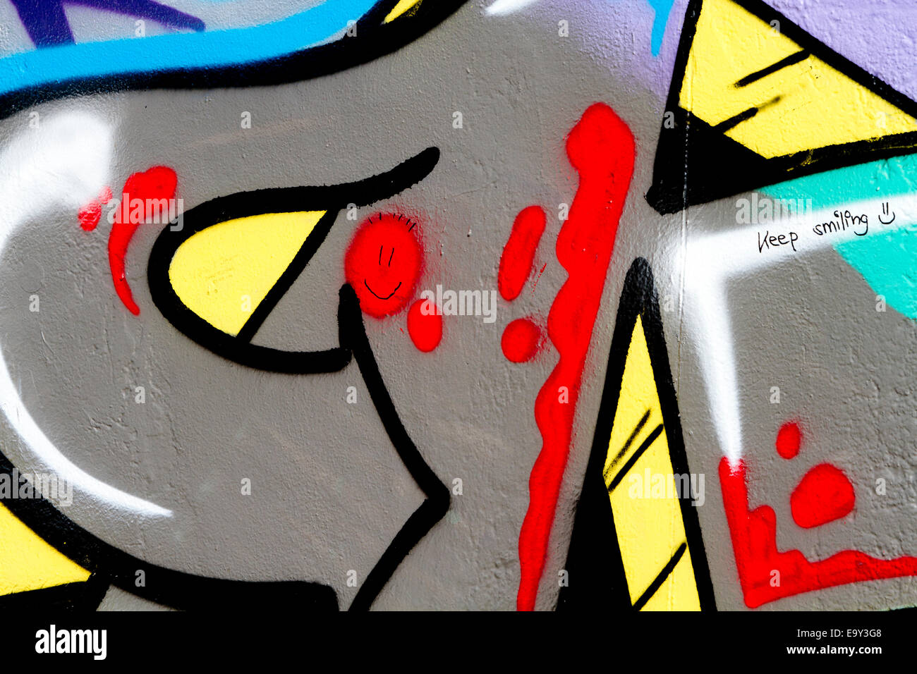 Halten Sie lächelndes Smiley Gesicht Berlin Wall graffiti Stockfoto