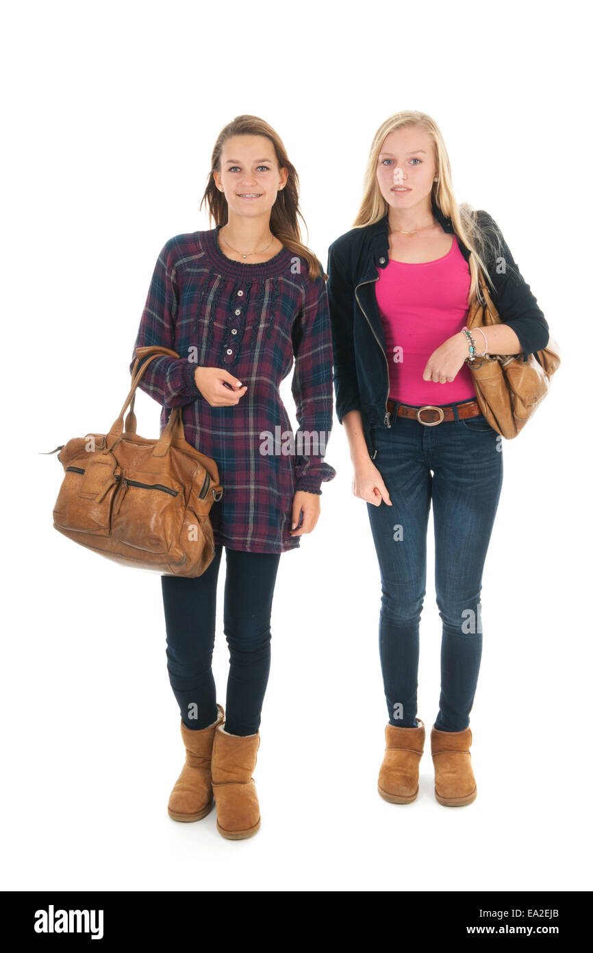 Schulmädchen zu Fuß in der Schule mit schweren Schultaschen Stockfoto