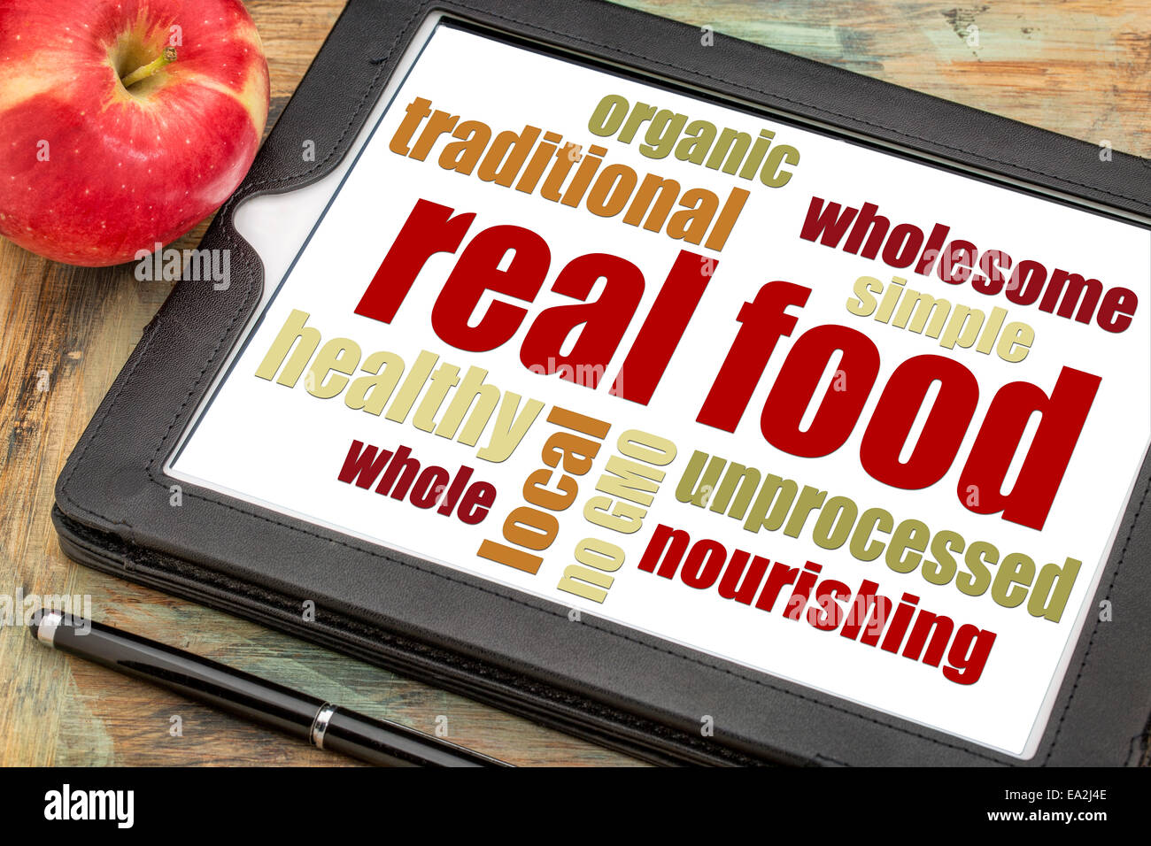 richtiges Essen Wortwolke auf einem digitalen Tablet mit einem Apfel - gesunde Lifestyle-Konzept Stockfoto