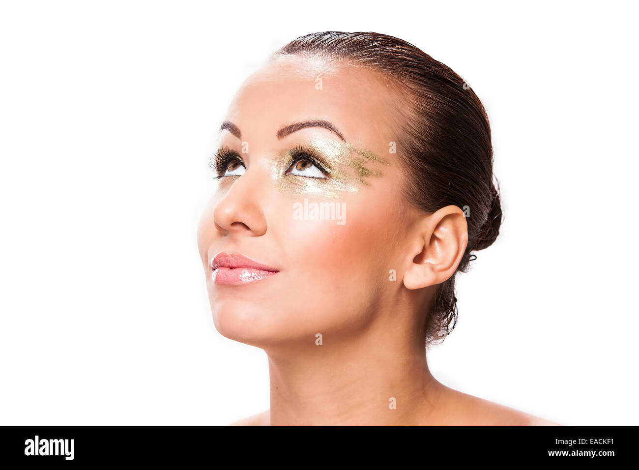 Schöne kaukasischen junge Frau mit gold Make-up. Stockfoto
