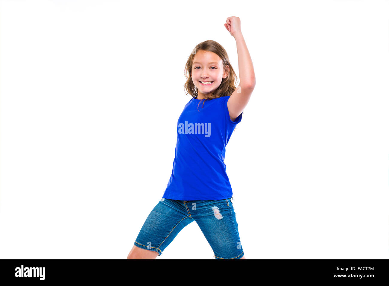 Aufgeregt Gewinner Ausdruck Kind Mädchen Hände Geste Bluejeans auf weißem Hintergrund Stockfoto