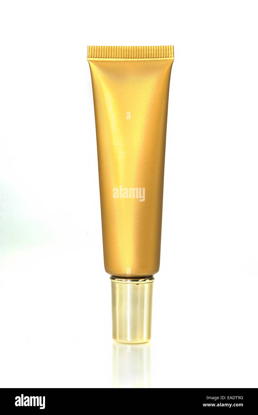 Gold Creme Kosmetik-Flasche auf weißem Hintergrund Stockfoto