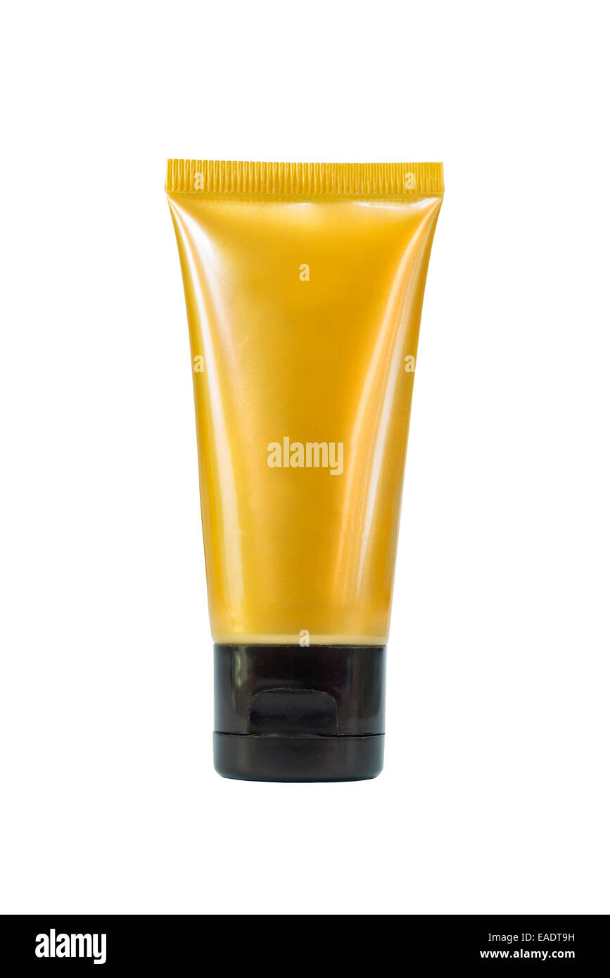 Gold Creme Kosmetik-Röhrchen auf isoliert Stockfoto