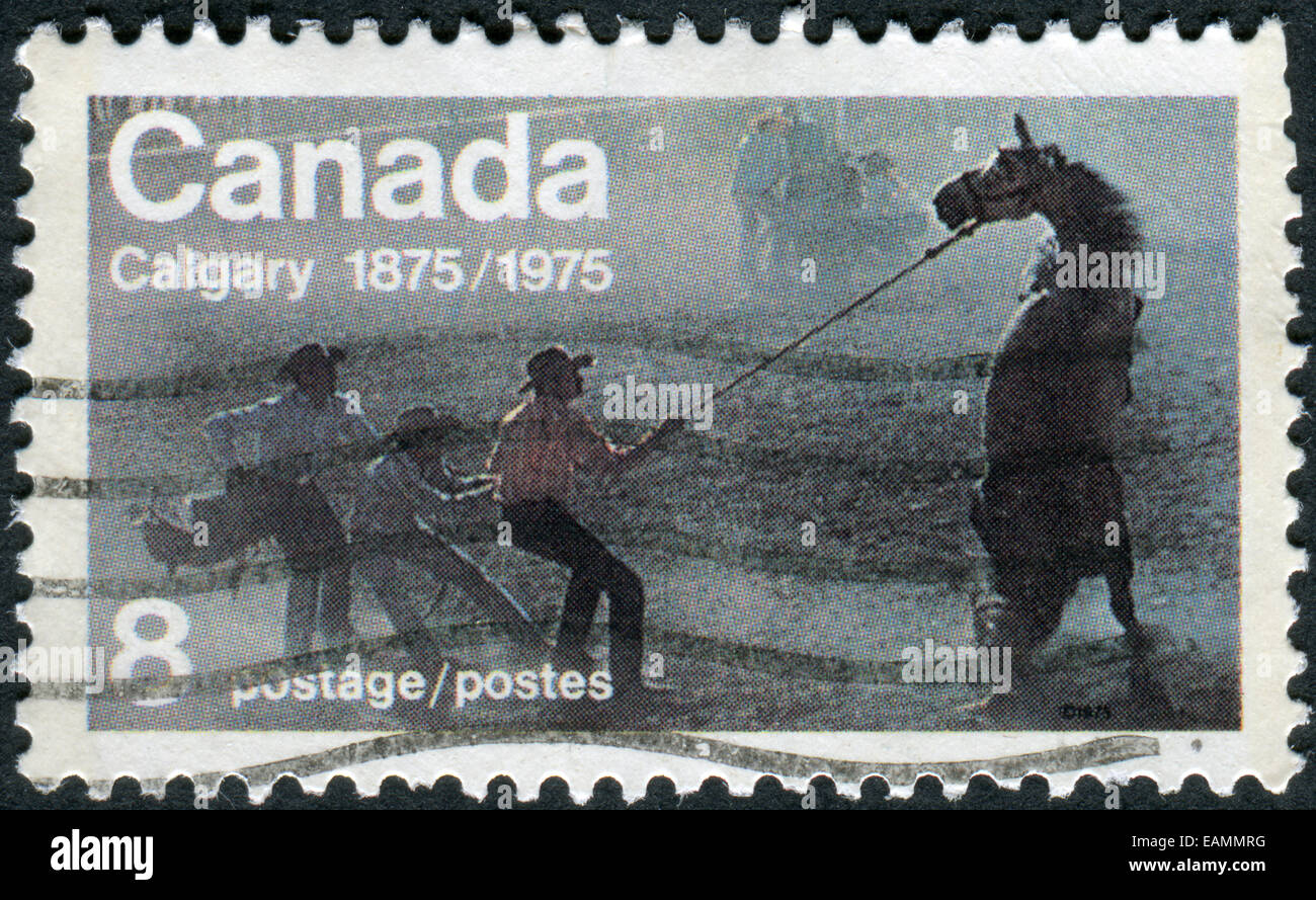 Gedruckt in Kanada, zur Hundertjahrfeier der Gründung der Calgary, Briefmarke zeigt die "Untamed" (Wild Horse Race) Stockfoto