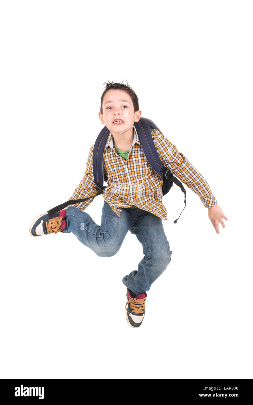 Junge Schüler springen isoliert in weiss Stockfoto