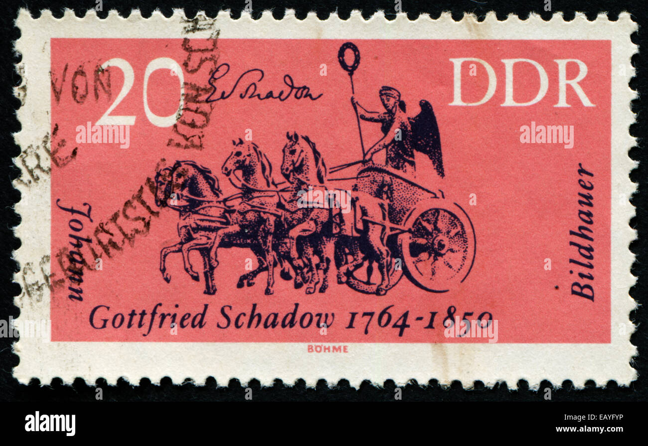 Deutsche Demokratische Republik - CIRCA 1964: Eine Briefmarke gedruckt in Deutschland aus der "Kulturellen Jubiläen" Ausgabe zeigt Quadriga, Kleie Stockfoto