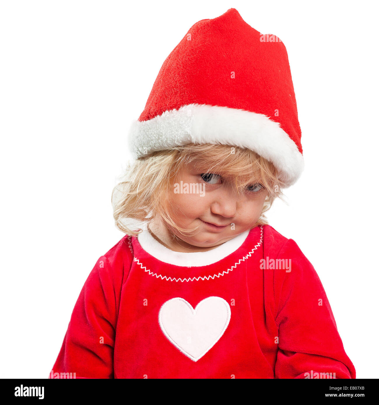 Cute blonde Kleinkind Mädchen verkleidet als Weihnachtsmann, isoliert auf weiss Stockfoto