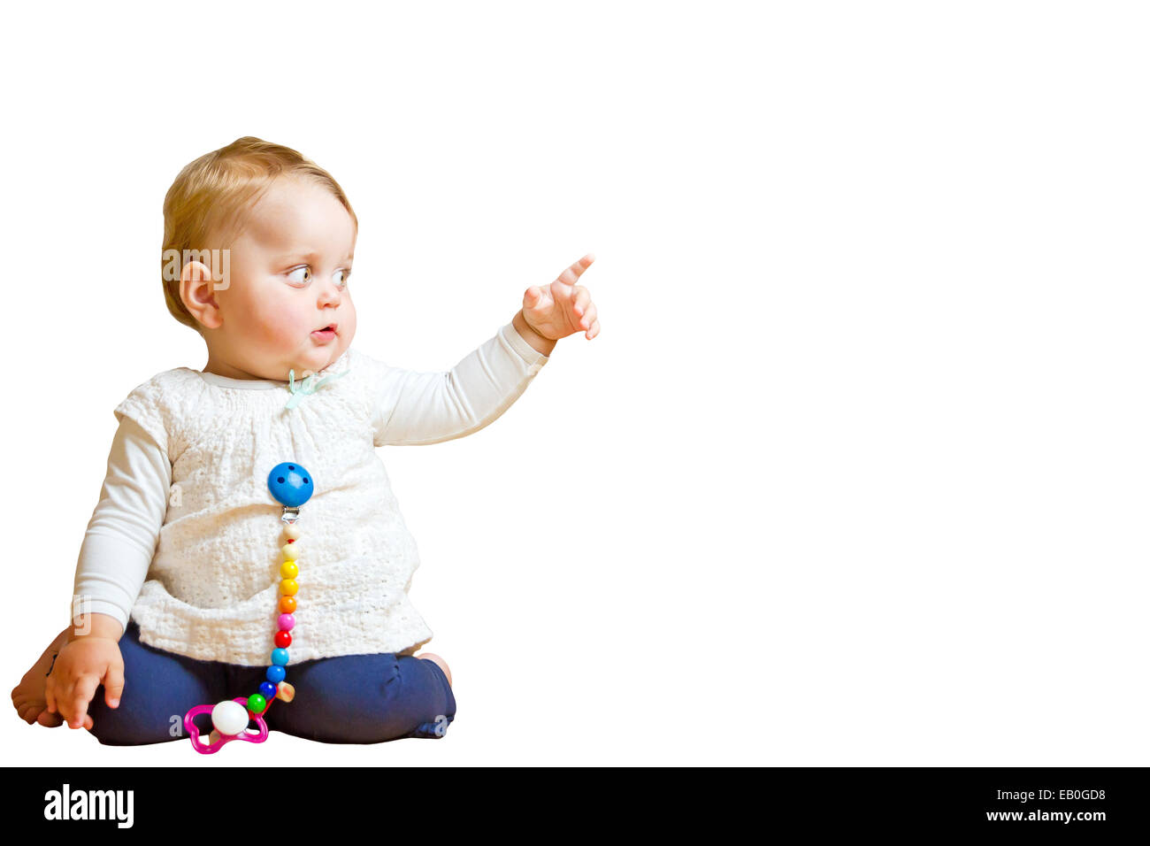 Fröhlich, neugierig Baby mit Handzeichen Stockfoto