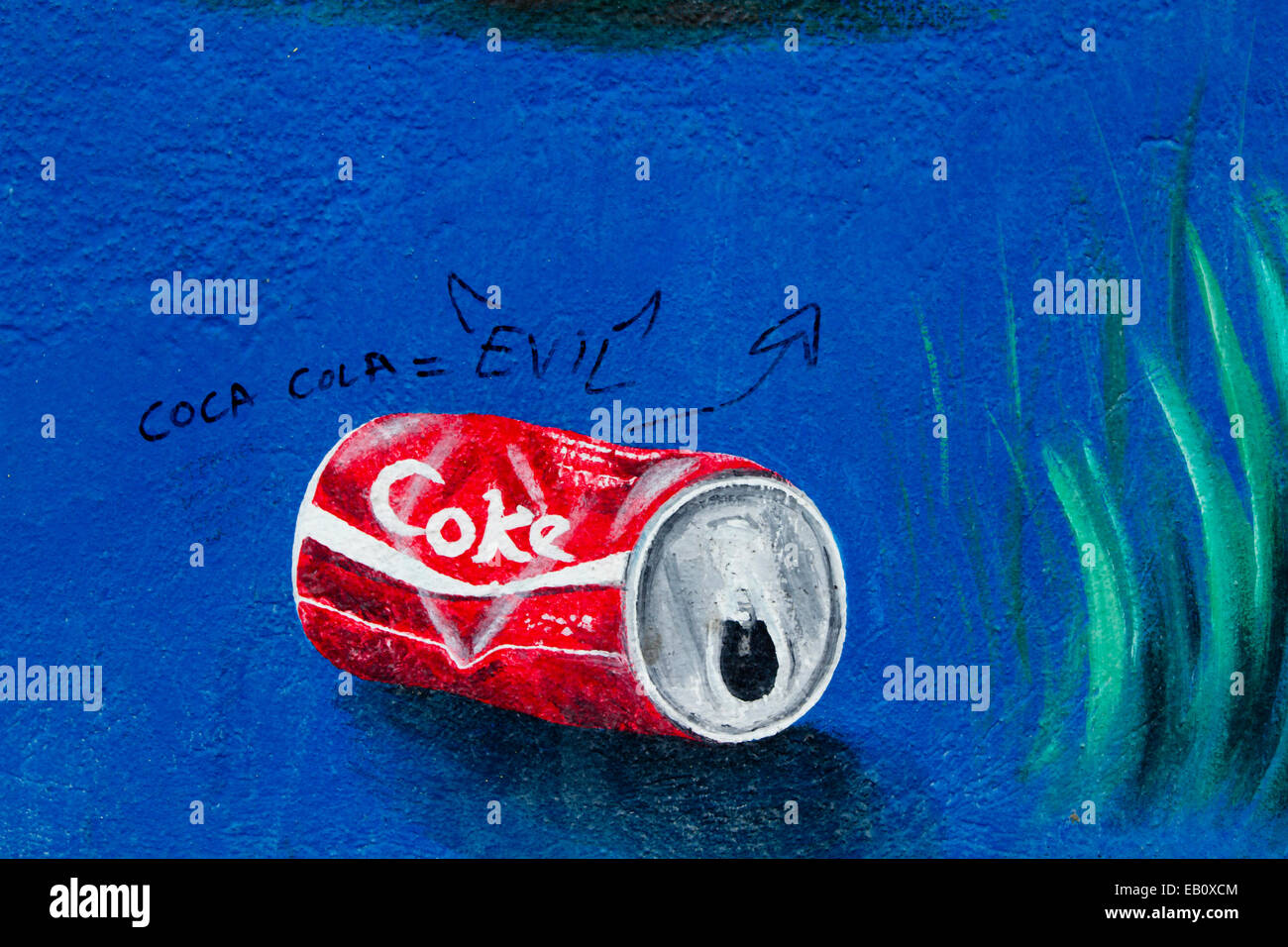 Berliner Mauer Graffiti Street Art Coca-Cola böse Stockfoto