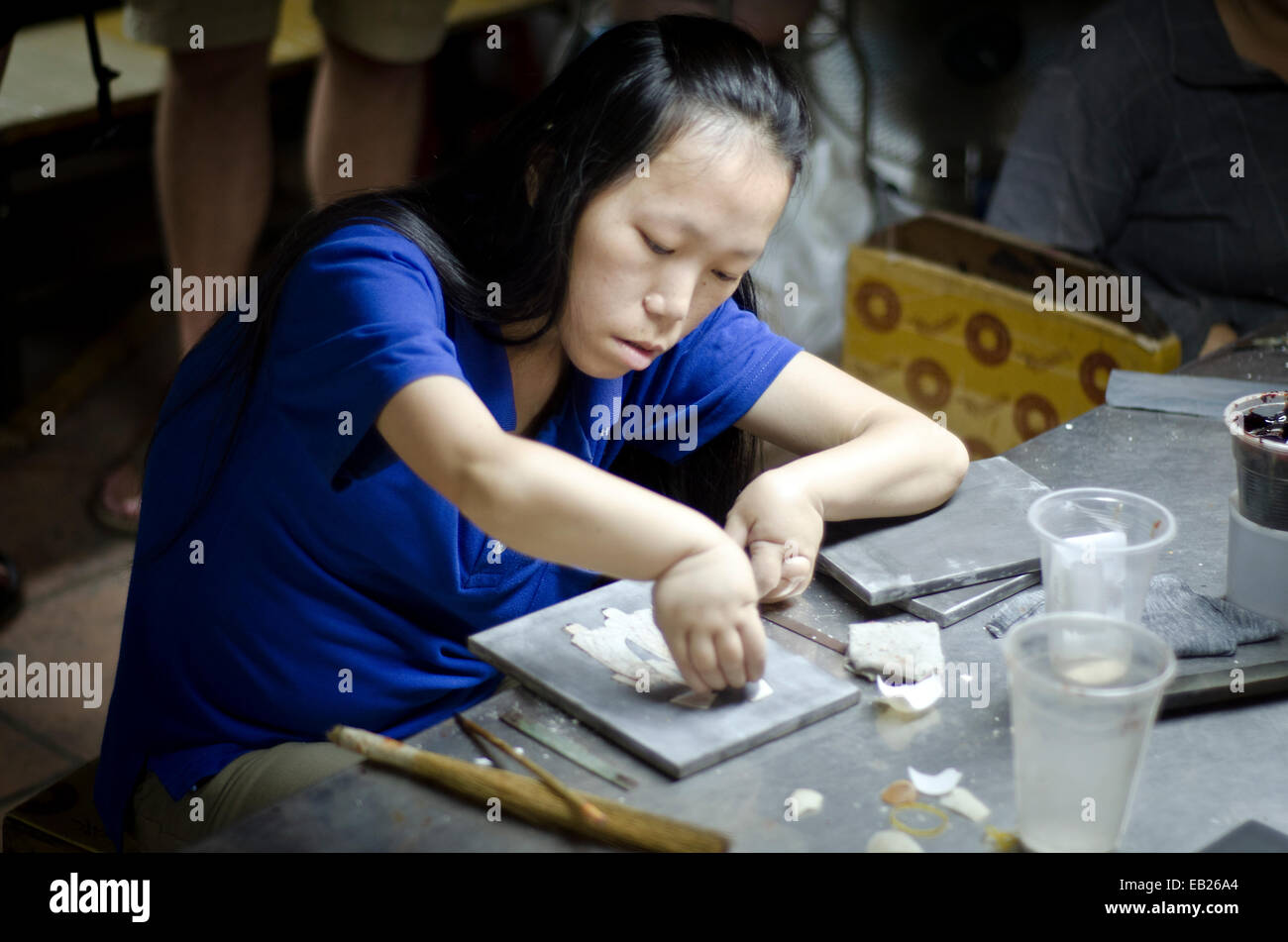Agent Orange Opfer in einer Lack Fabrik, Ho Chi Minh, Vietnam Stockfoto