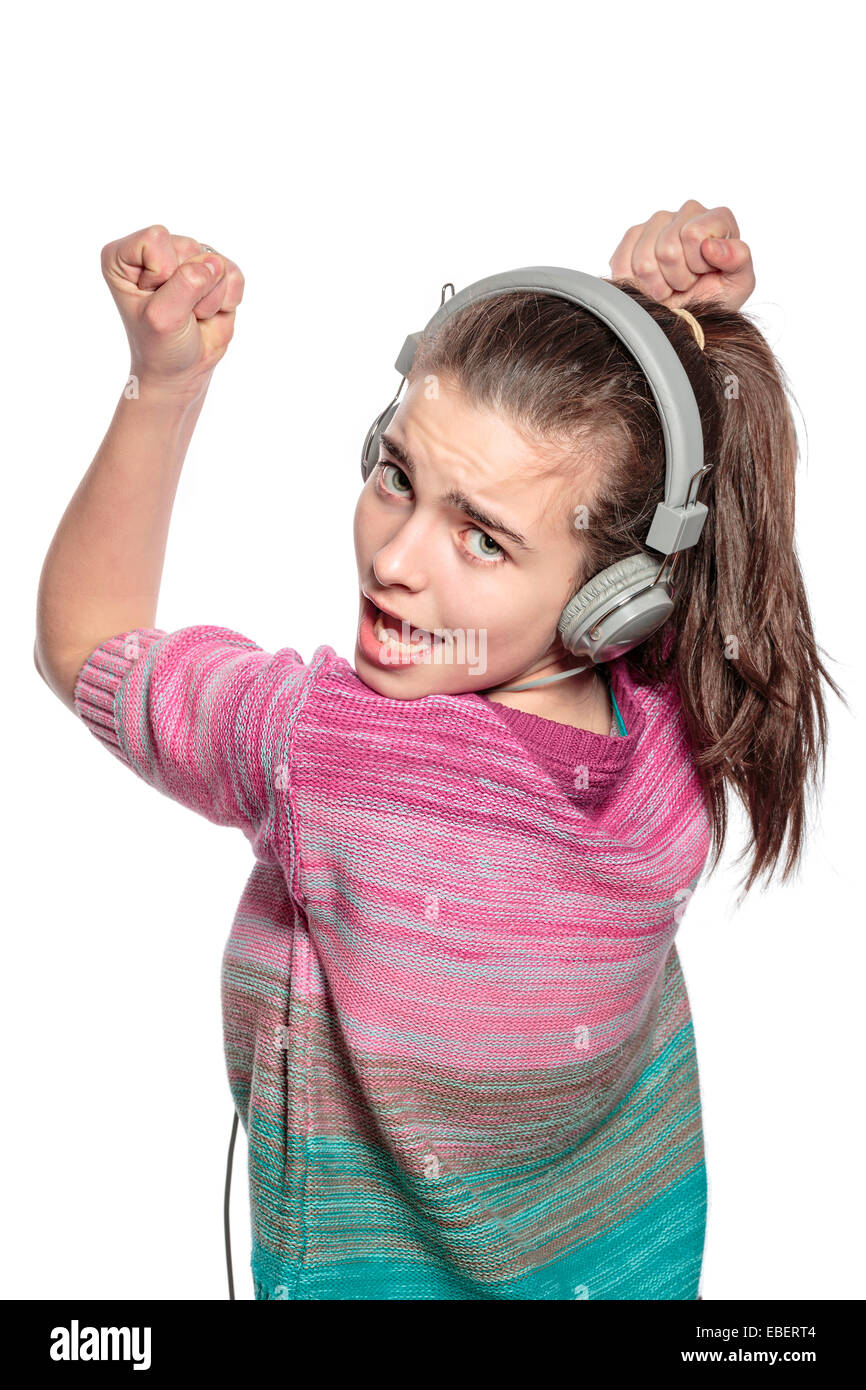 begeisterte Teenager-Mädchen mit Kopfhörern, isoliert auf weiss Stockfoto