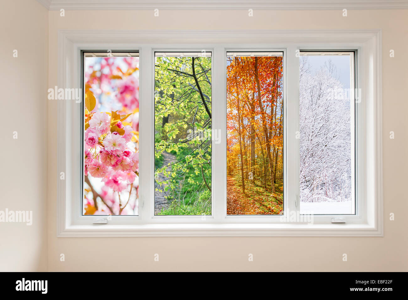Fenster in Wohngebäude mit Blick auf die vier Jahreszeiten Stockfoto