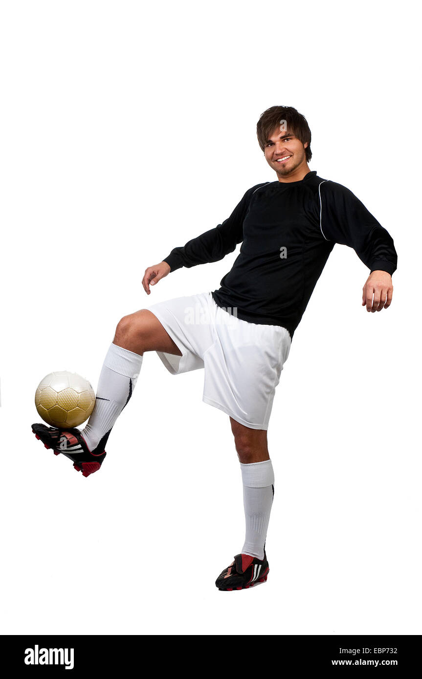 Fußball-Spieler einen Ball, Deutschland Stockfoto