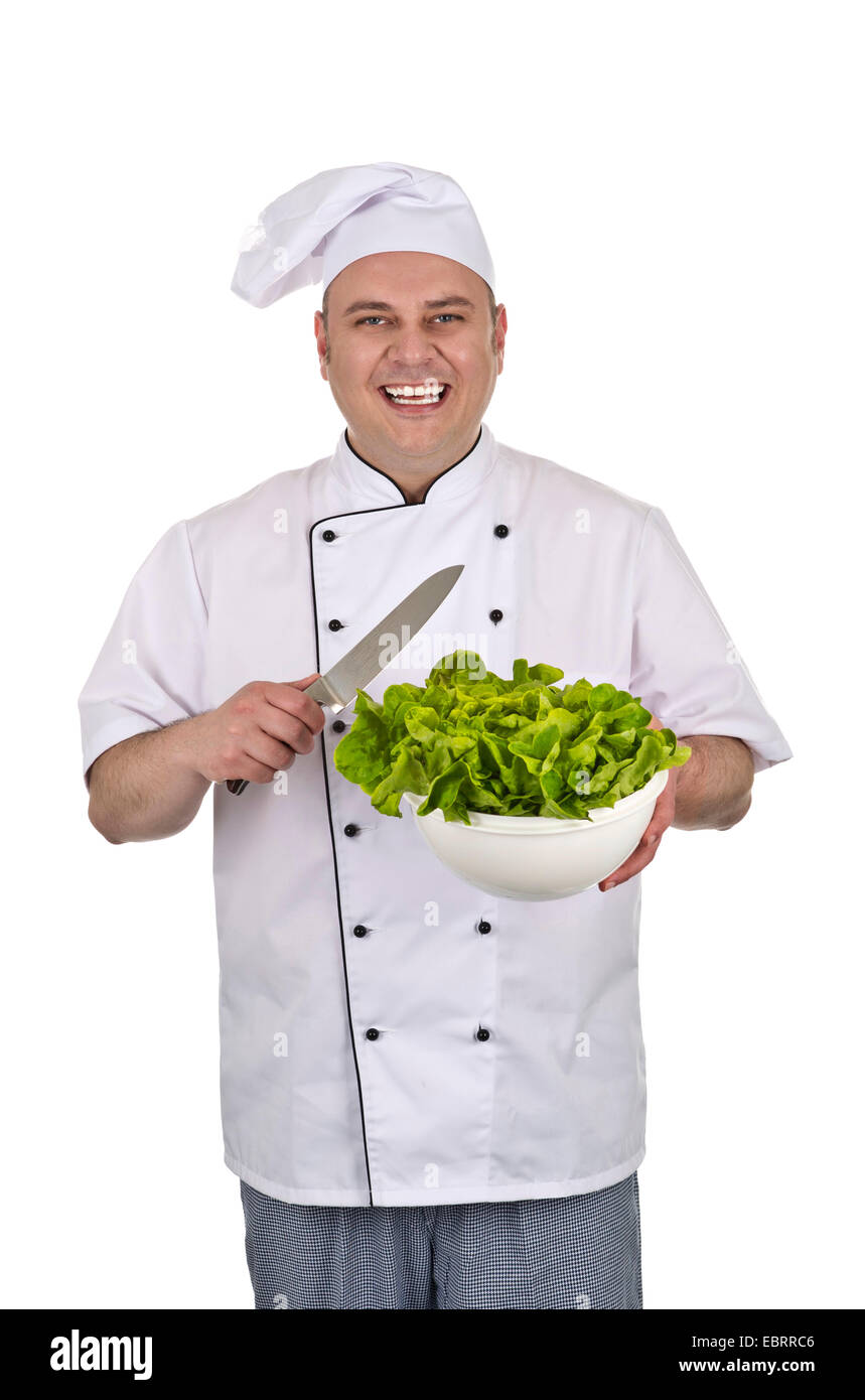 Kochen Sie mit Küchenmesser und Salat Stockfoto
