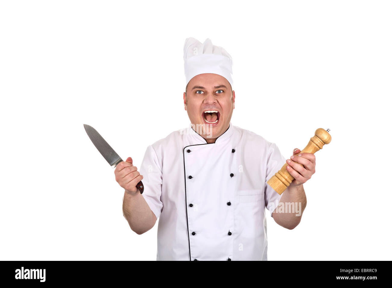 Kochen Sie mit Küchenmesser und Pfeffermühle Stockfoto