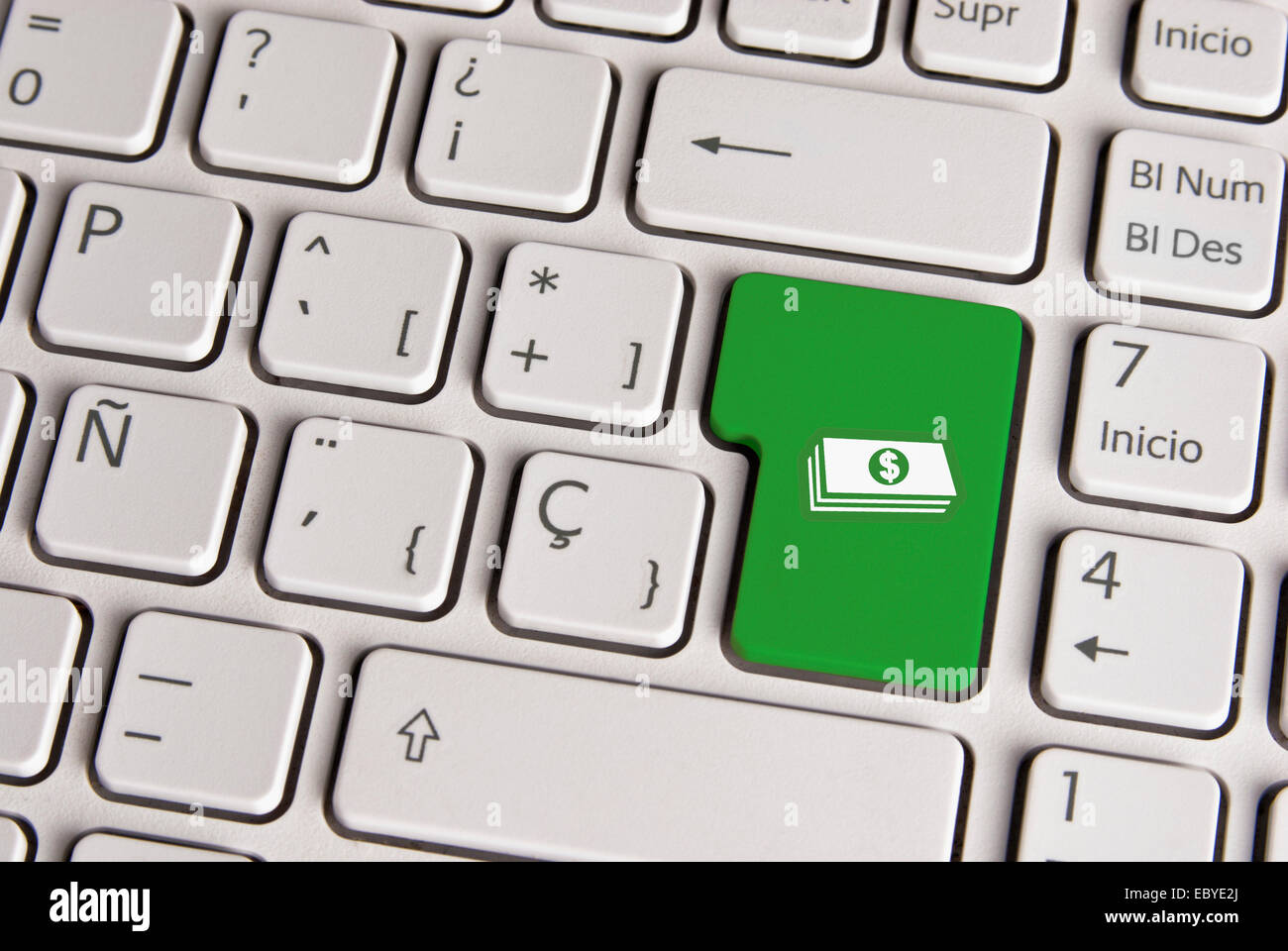 Spanische Tastatur mit Geld Cash-Symbol über Schaltfläche "grünen Hintergrund". Bild mit Beschneidungspfad für einfachen Wechsel der Key-Farbe und e Stockfoto