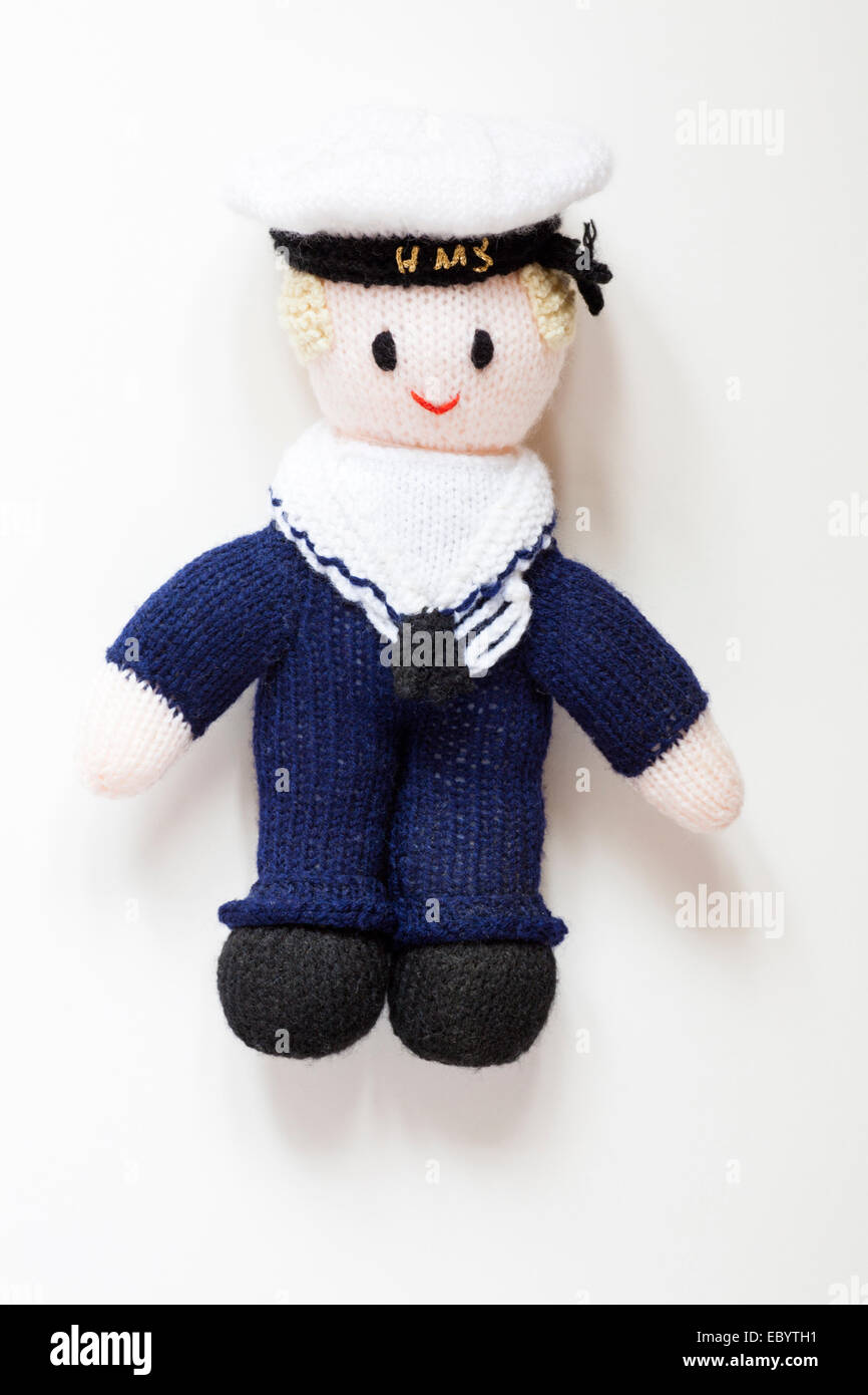 Gestrickte Puppe sailor in Uniform auf weißem Hintergrund Stockfoto