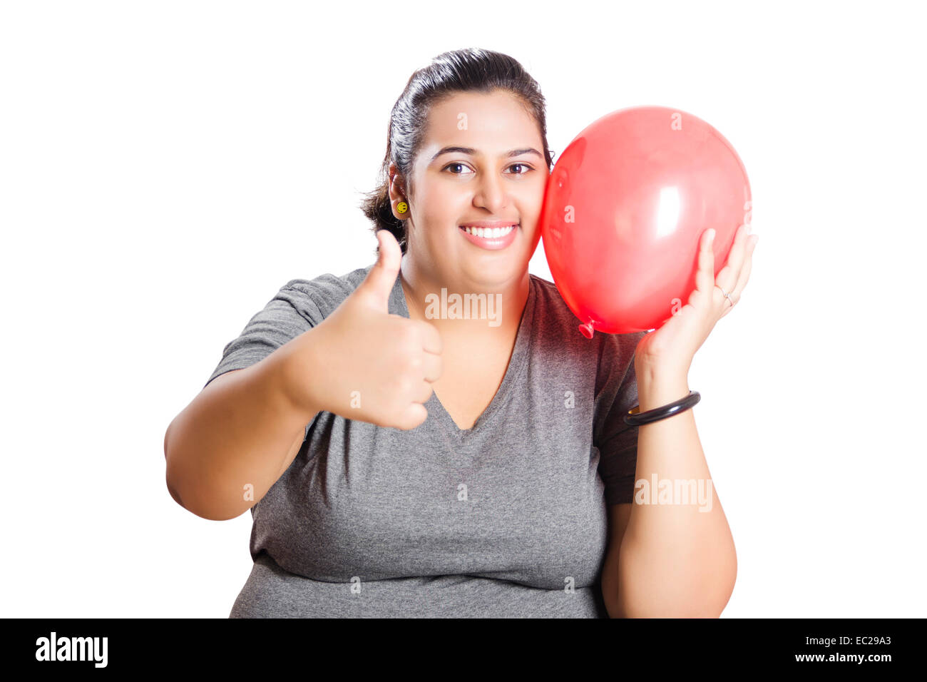 Fettleibige Inderin mit Ballon Stockfoto