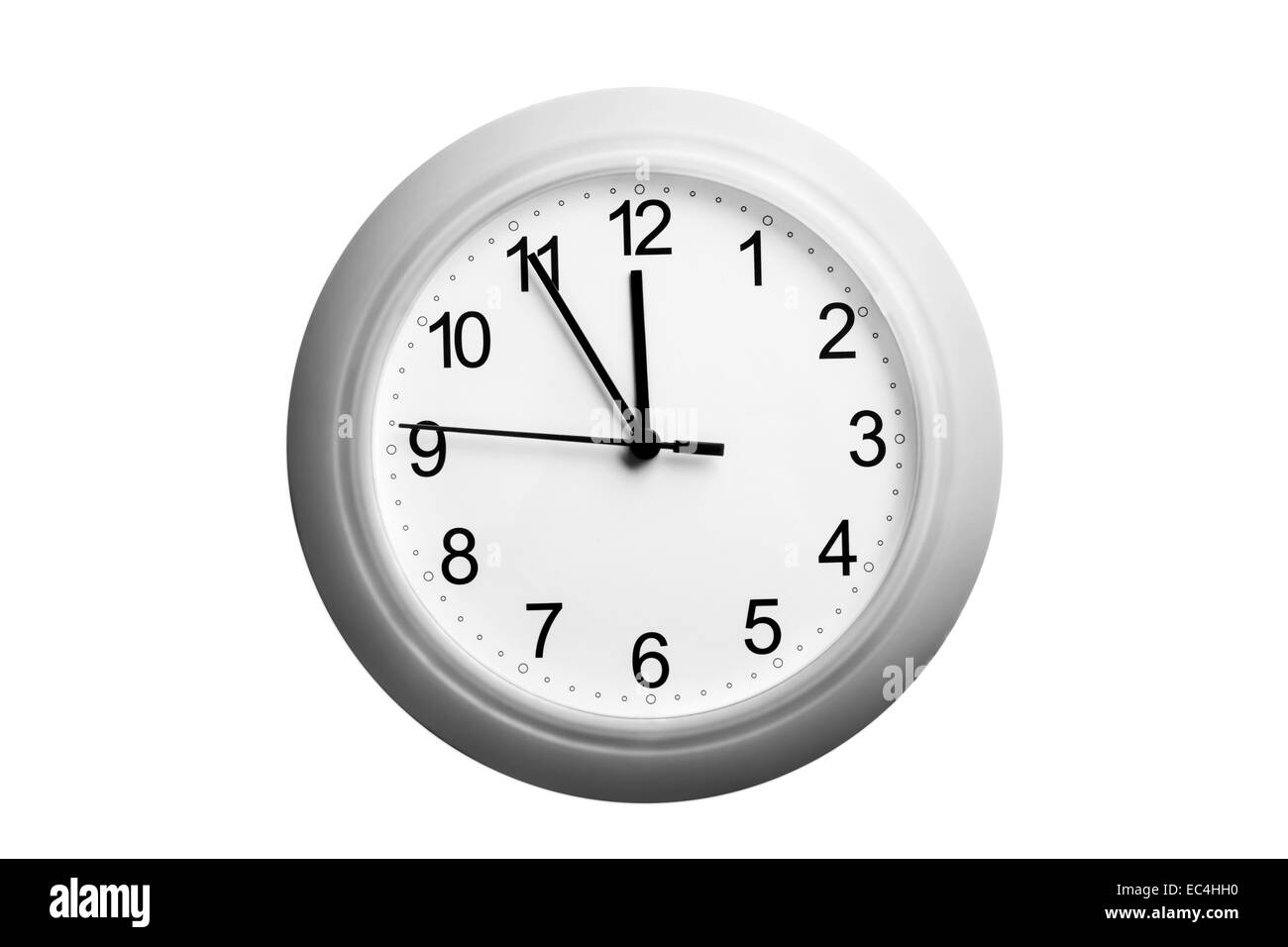 Eine einzelne einfache Uhr zeigt die Zeit fünf vor zwölf Stockfoto