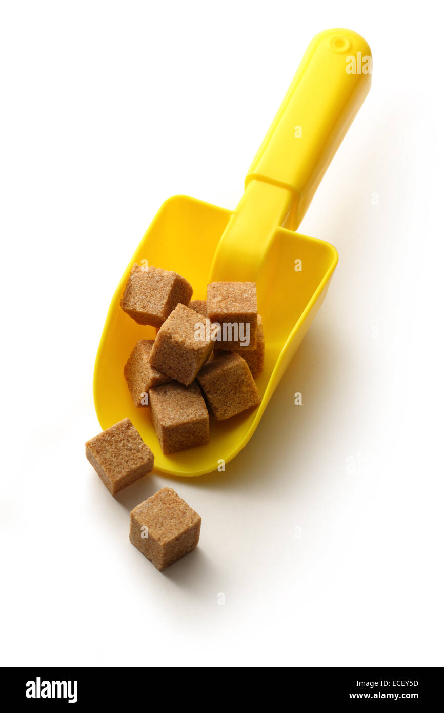 Würfel Zucker mit Plastiklöffel Stockfoto