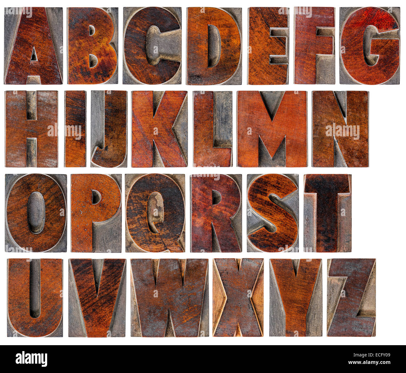 eine komplette englische Großbuchstaben-Alphabet - eine Collage aus 26 isolierte Antik Holz Buchdruck Druckstöcke mit Tinte patina Stockfoto