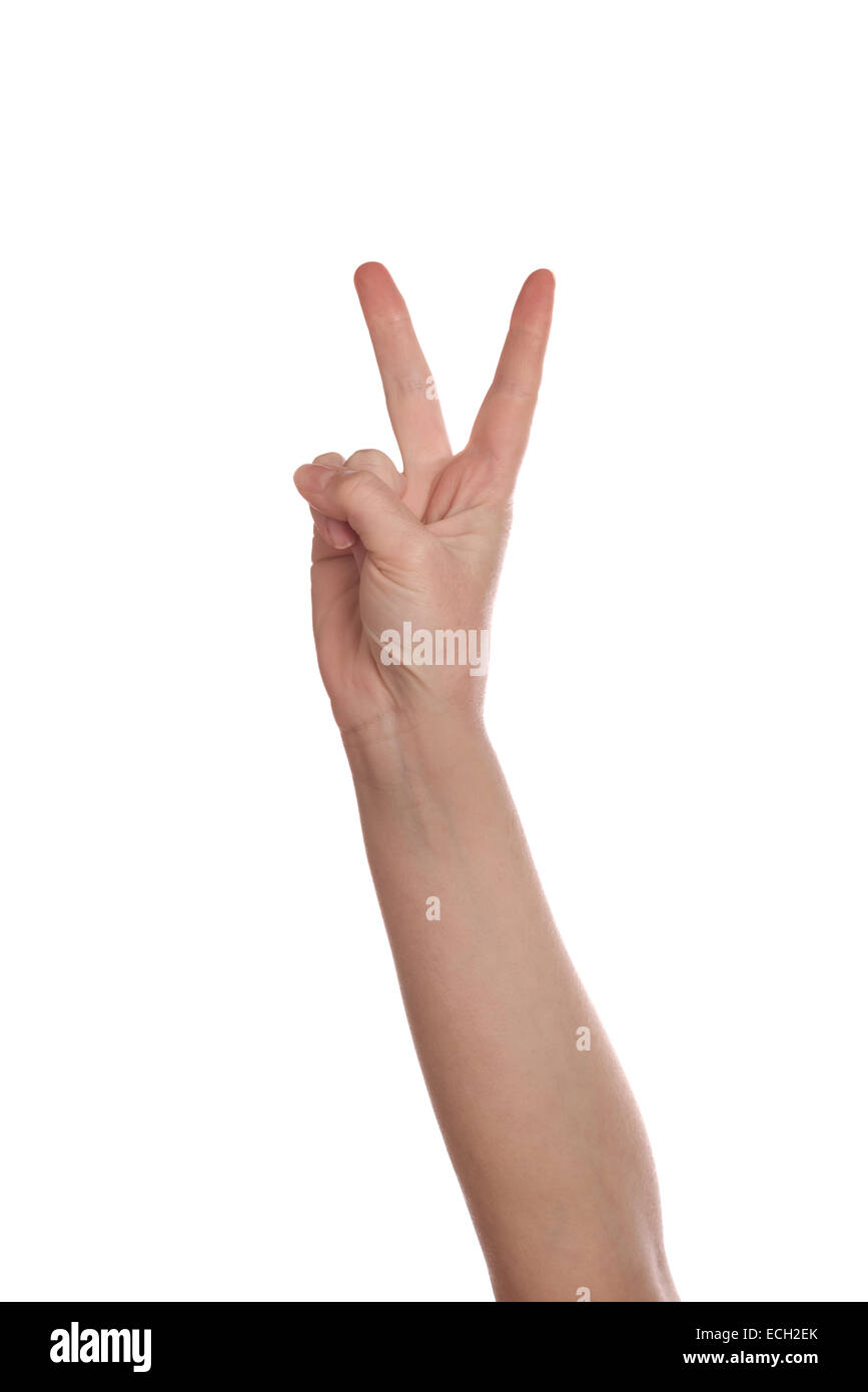 Kaukasische weiße weibliche Hand machen zwei Finger isolierten auf weißen Hintergrund zu unterzeichnen. Abstimmung oder Sieg Konzept. Stockfoto