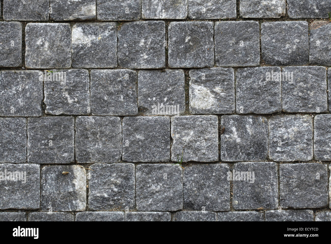 Kopfsteinpflaster Granit Würfel gemacht. Hintergrundtextur. Stockfoto