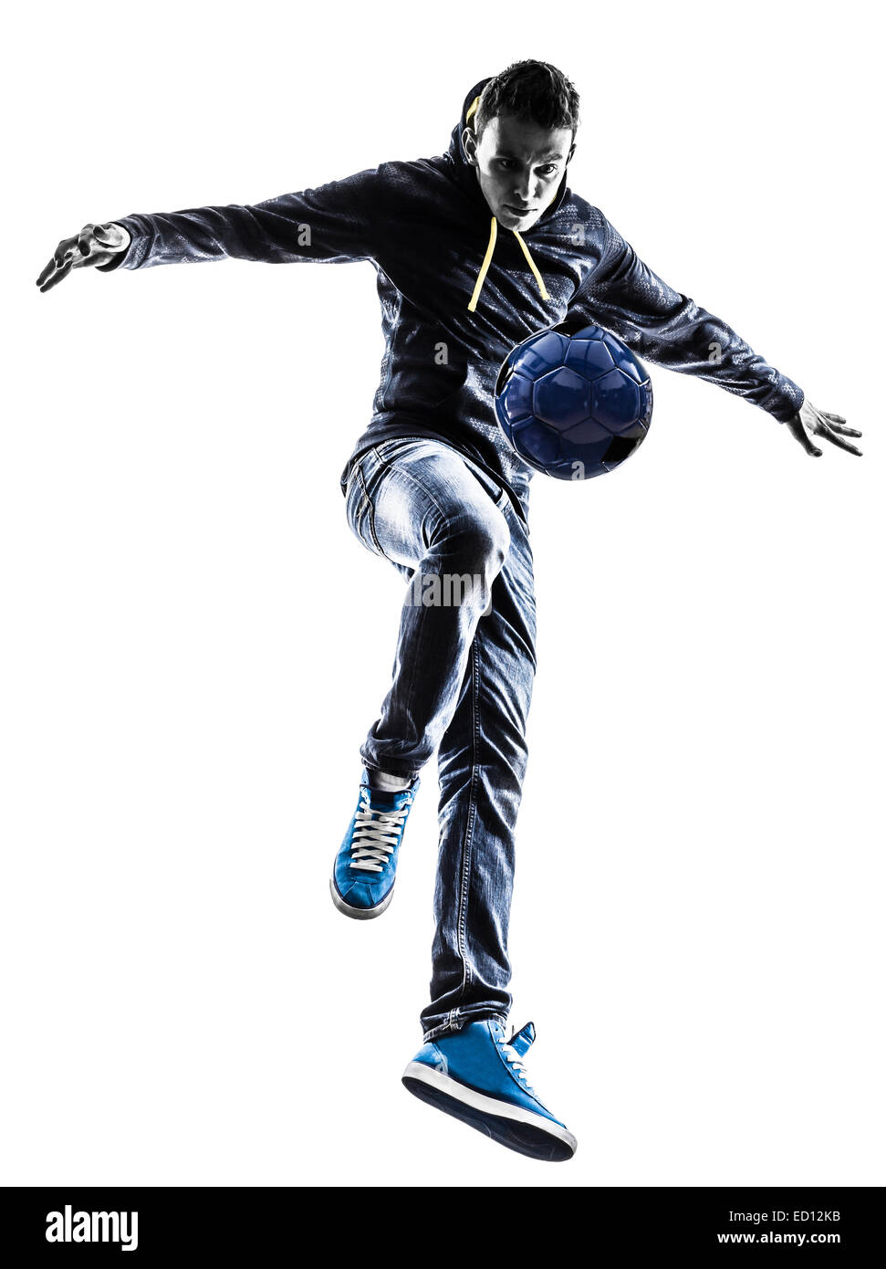 ein junger Mann Freestyler Fußballspieler in der Silhouette auf weißem Hintergrund Stockfoto