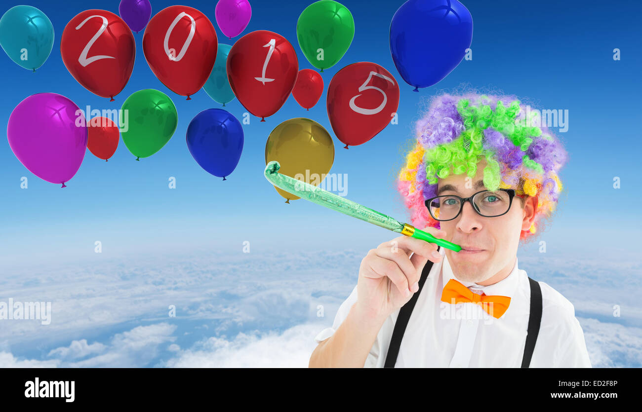 Zusammengesetztes Bild von Geek Partei Horn bläst Stockfoto