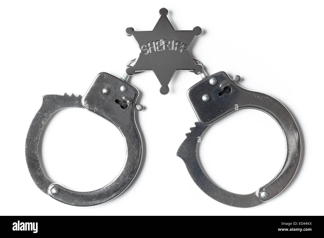Sheriff Sternen und gesperrten Handschellen isoliert auf weißem Hintergrund Stockfoto